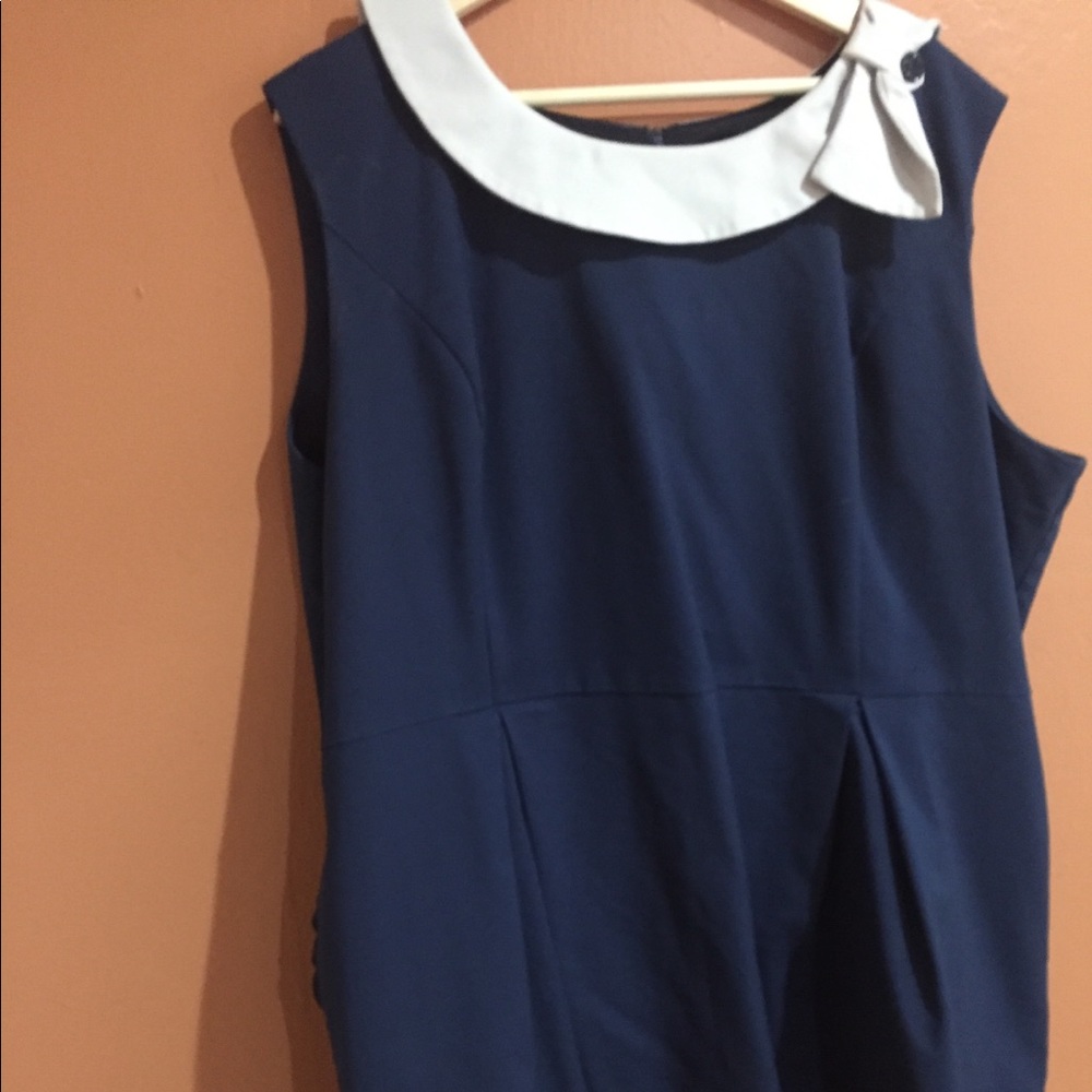 Adorable sheath dress with box pleats.